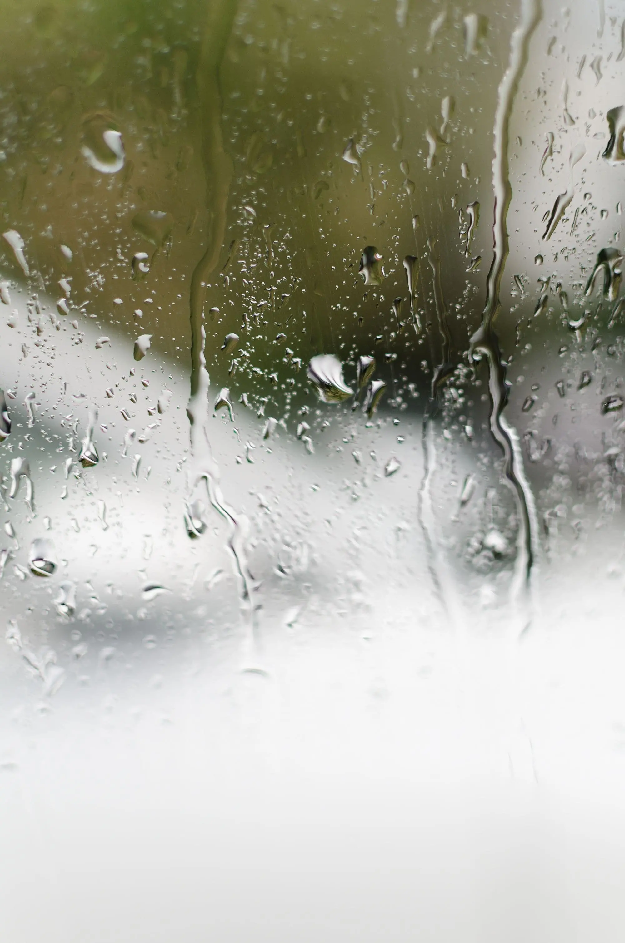 Water droplets condensing on a glass window, the principle behind an atmospheric water generator
