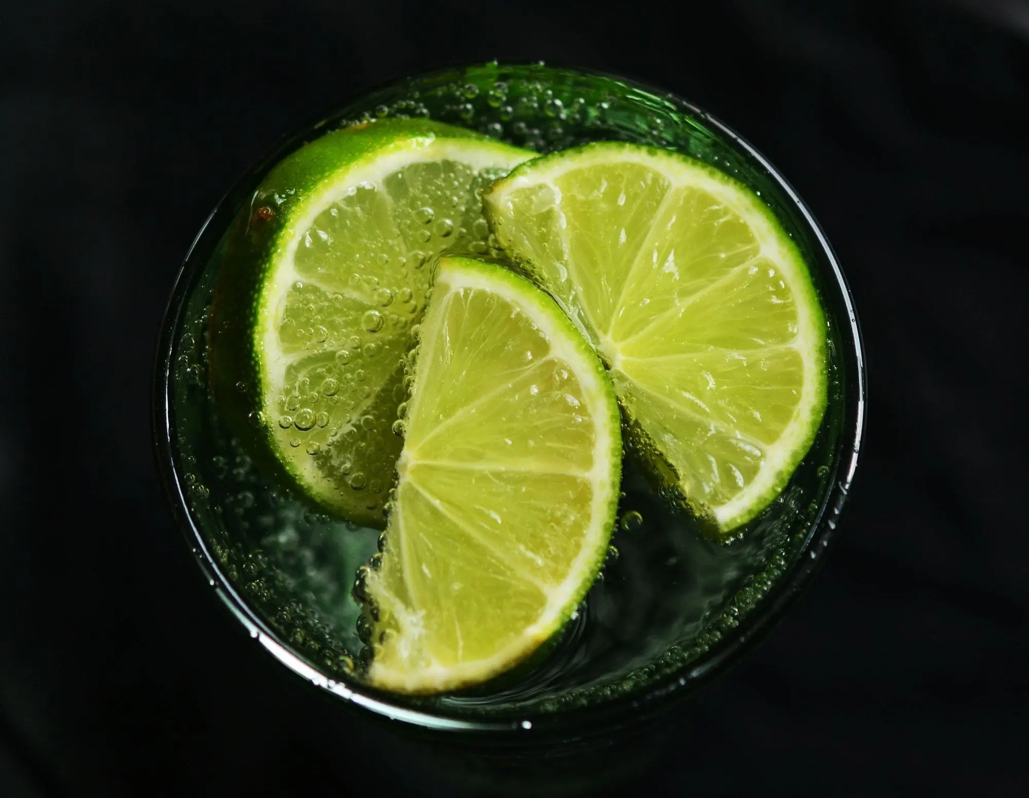 Lime slices in a glass of sparkling water