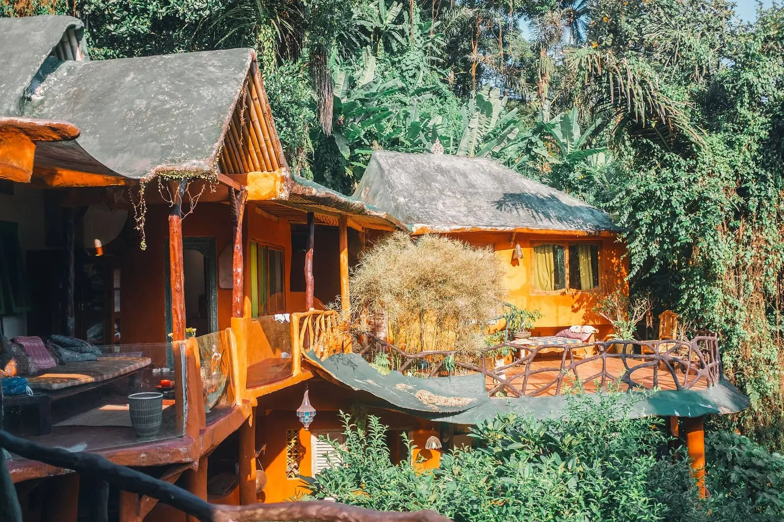 Wooden bungalows among lush tropical gardens on a Thai island