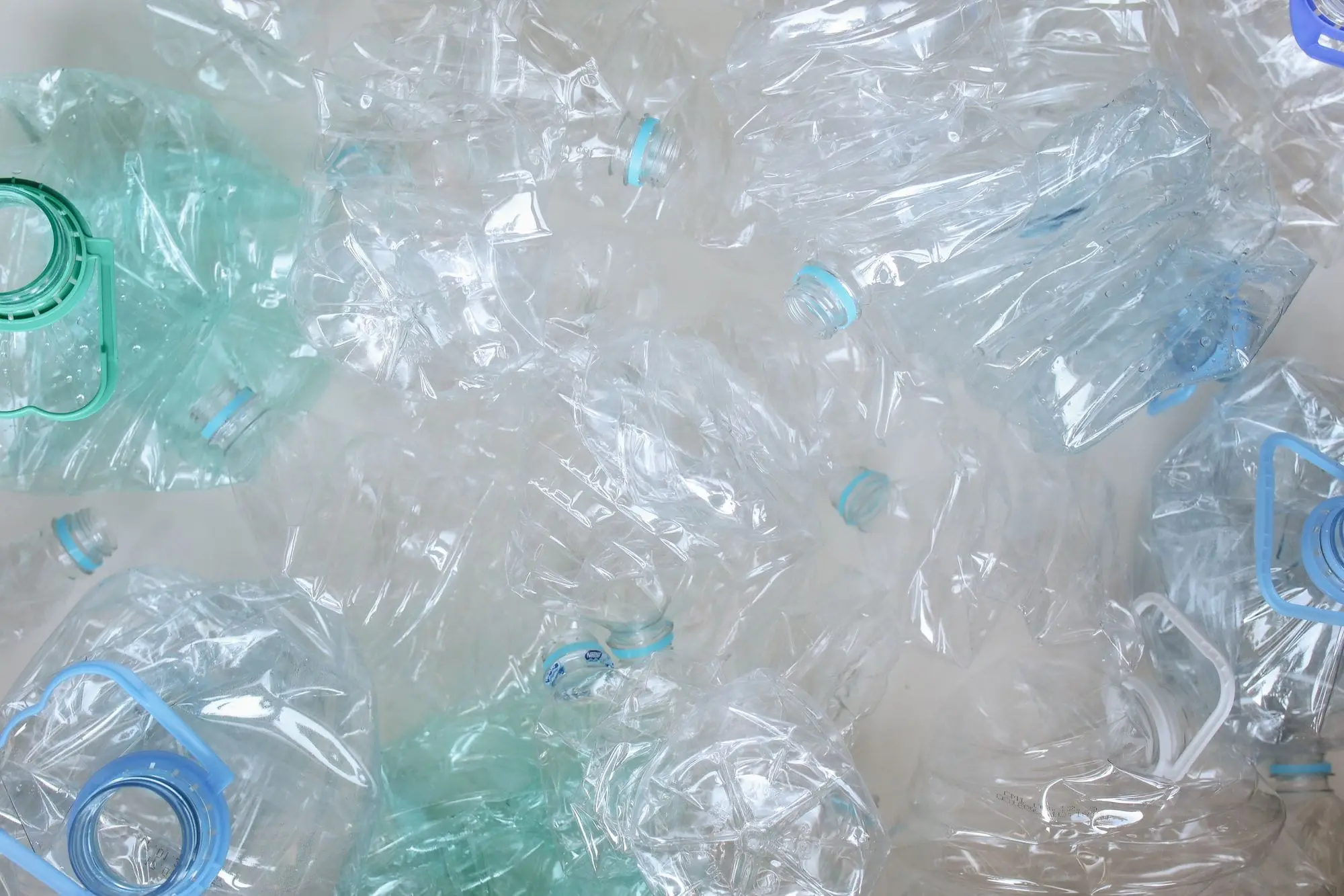 Pile of crushed empty plastic water bottles
