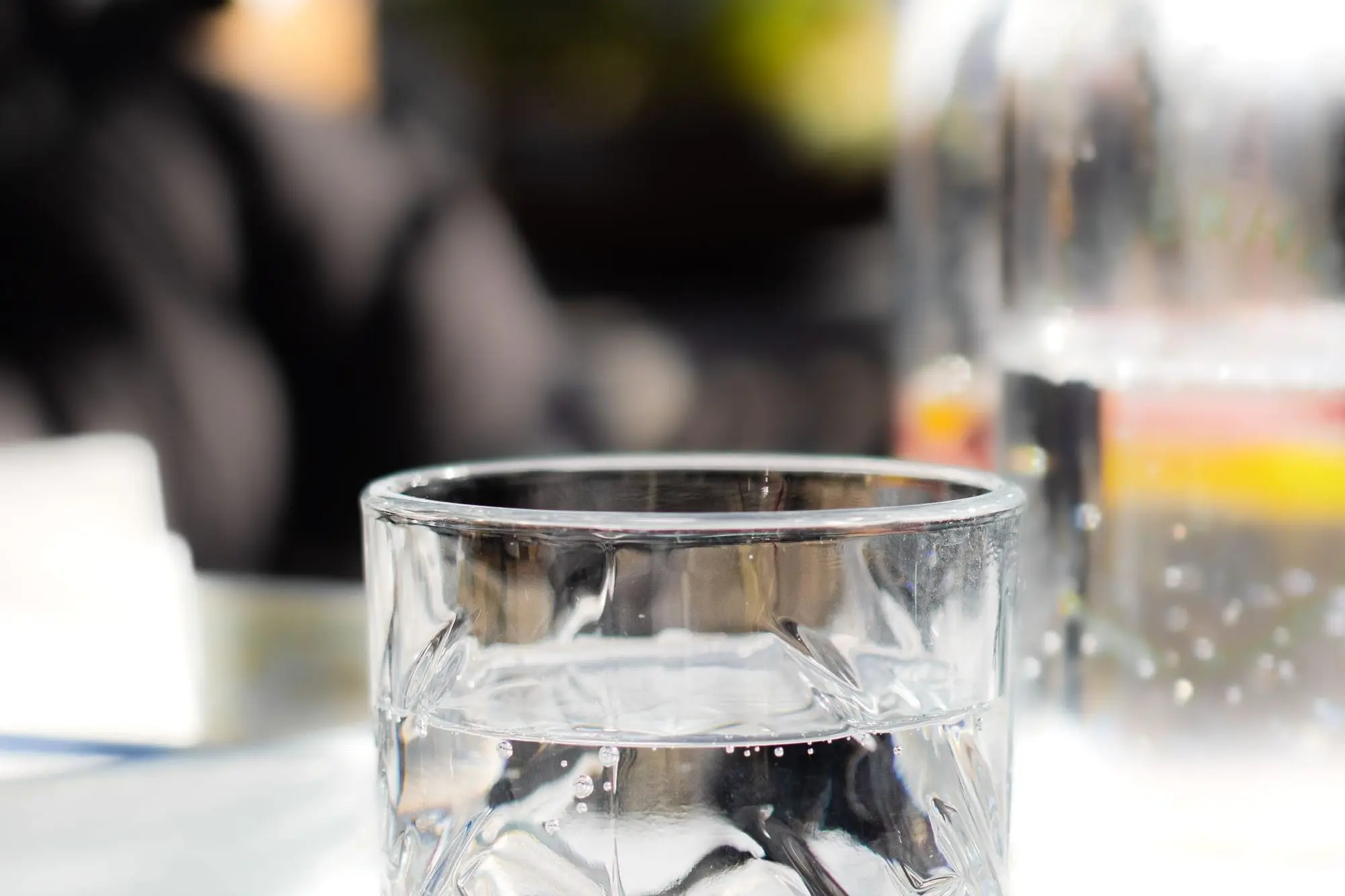 Glass of water on a sunlit table