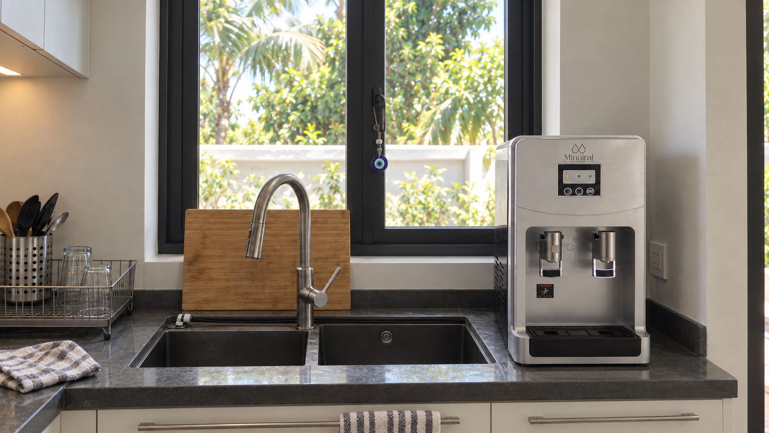 A Minairal Pure countertop system next to a kitchen sink